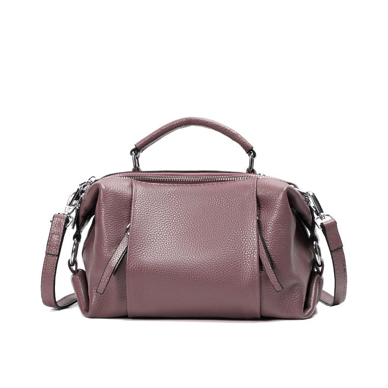 Single-shoulder solid color leather messenger bag for ladies, showcasing its stylish design and high-quality PU leather material.