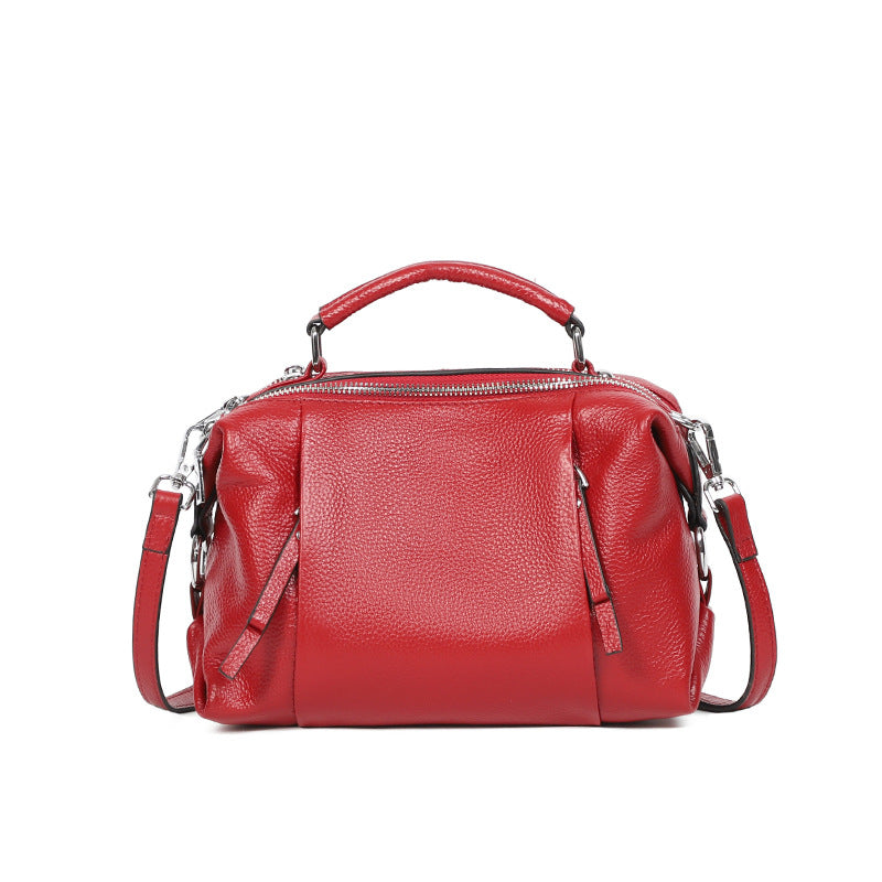 Single-shoulder solid color leather messenger bag for ladies, showcasing its stylish design and high-quality PU leather material.