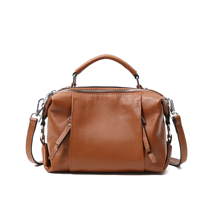 Single-shoulder solid color leather messenger bag for ladies, showcasing its stylish design and high-quality PU leather material.