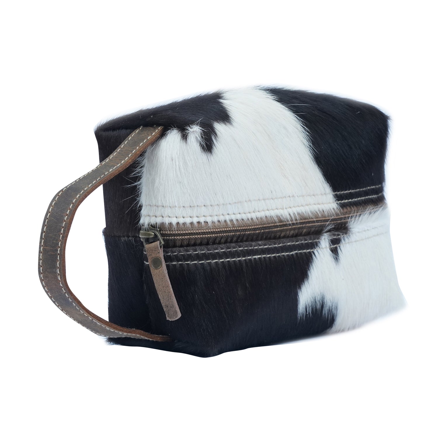 Stylish Skul Dopp Kit made from hairon and leather with zipped closure and cotton lining, showcasing its unique western design.