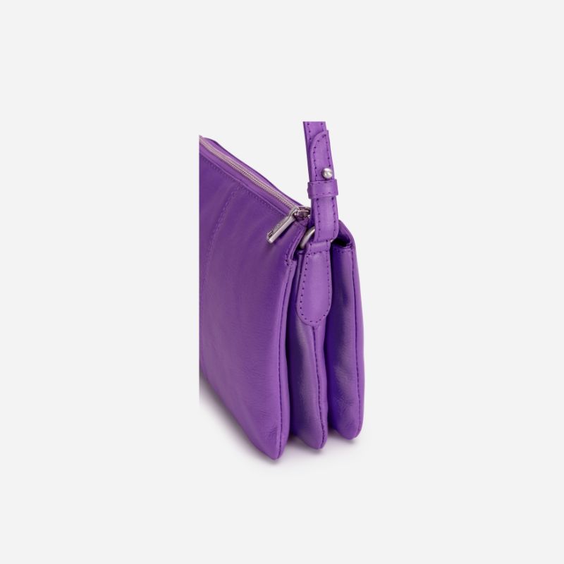 Slim Ladies Leather Crossbody bag in Electric Iris color, showcasing its stylish design and lightweight features.