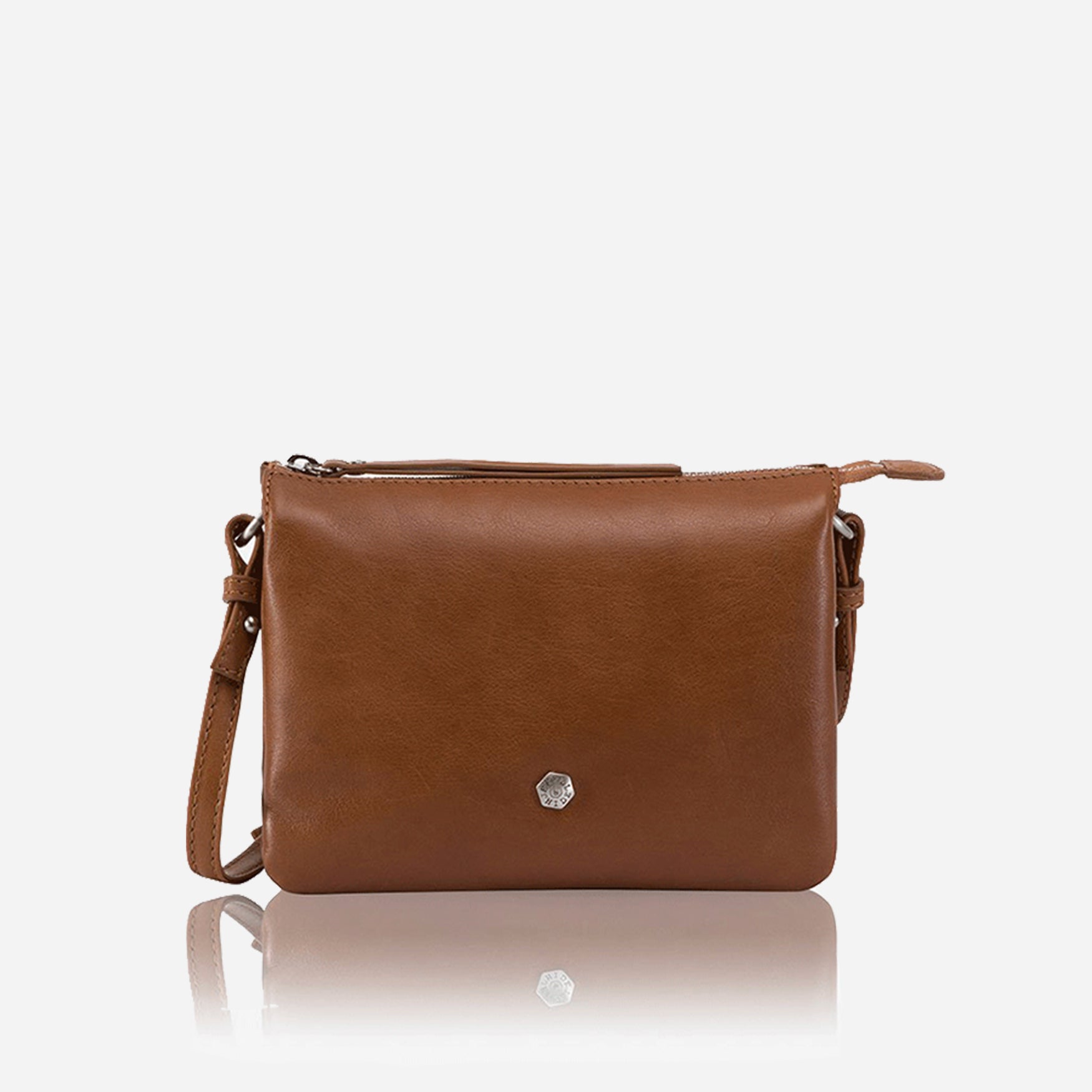 Slim Ladies Leather Crossbody bag in tan color, showcasing its stylish design and adjustable strap.