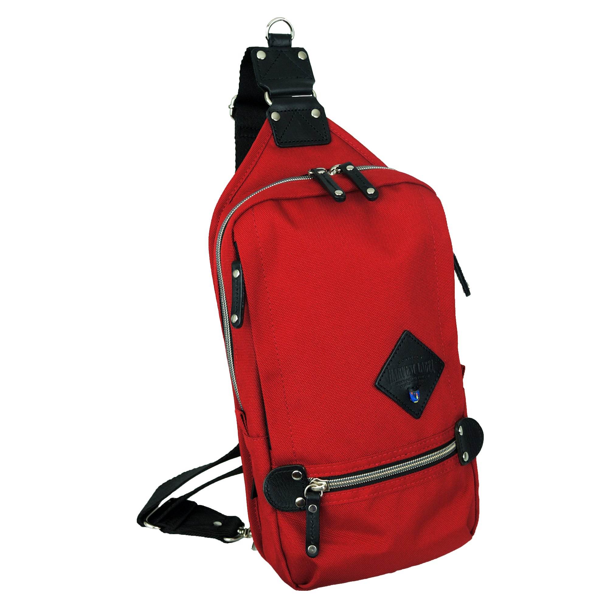 A stylish SLING PACK made from CORDURA® EcoMade Polyester, featuring multiple pockets and an adjustable strap, available in various colors.