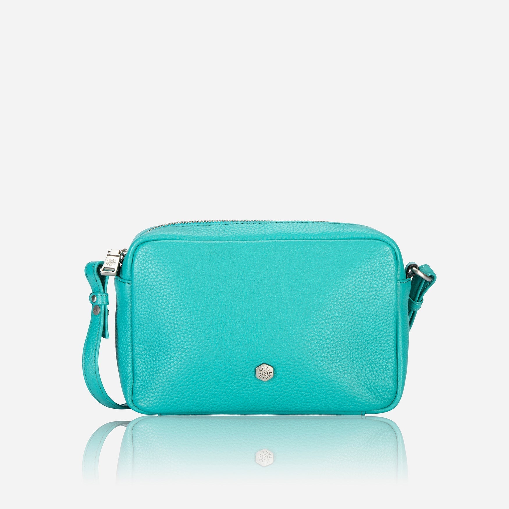 Small Crossbody bag in Calypso Teal with vibrant lining and adjustable strap.