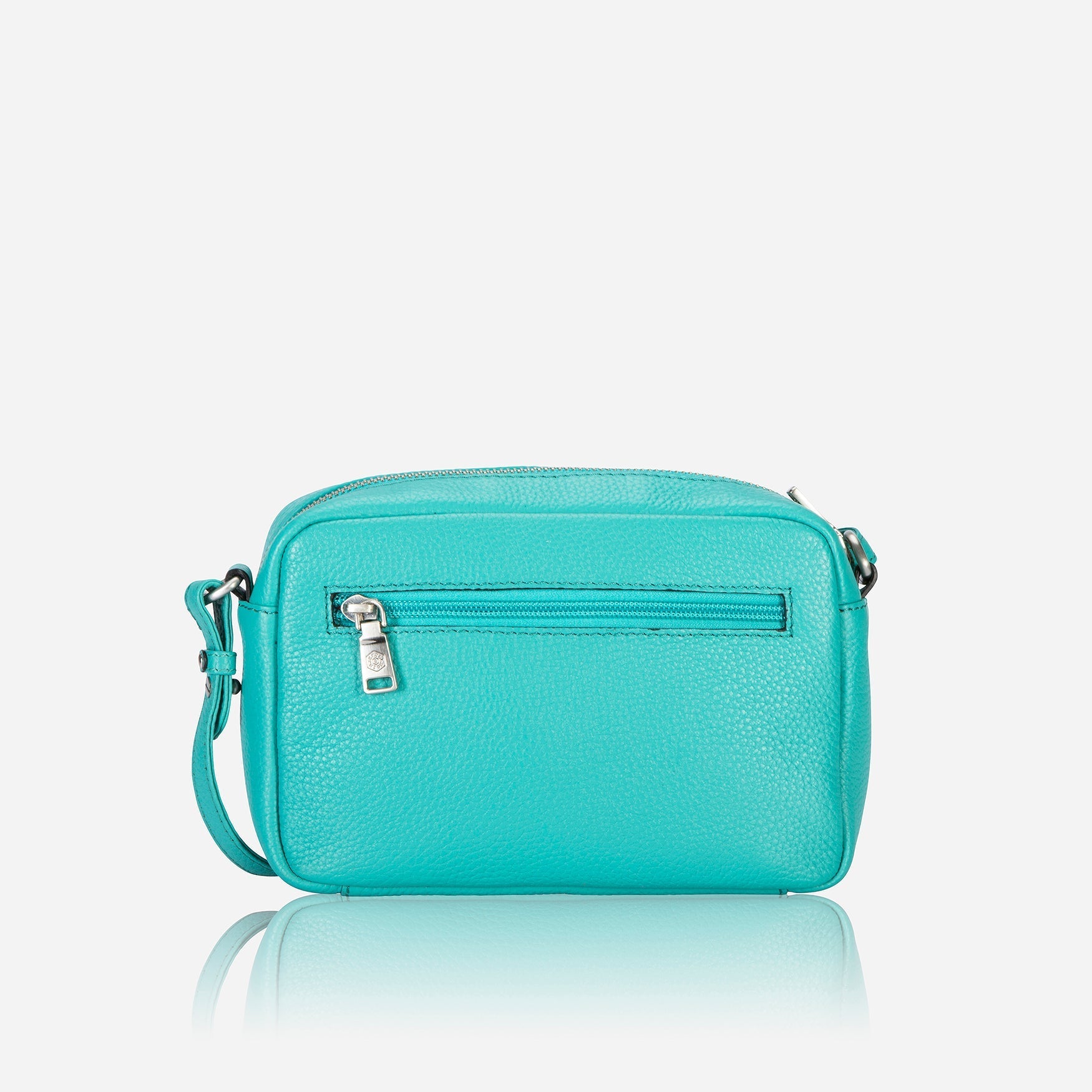 Small Crossbody bag in Calypso Teal with vibrant lining and adjustable strap.