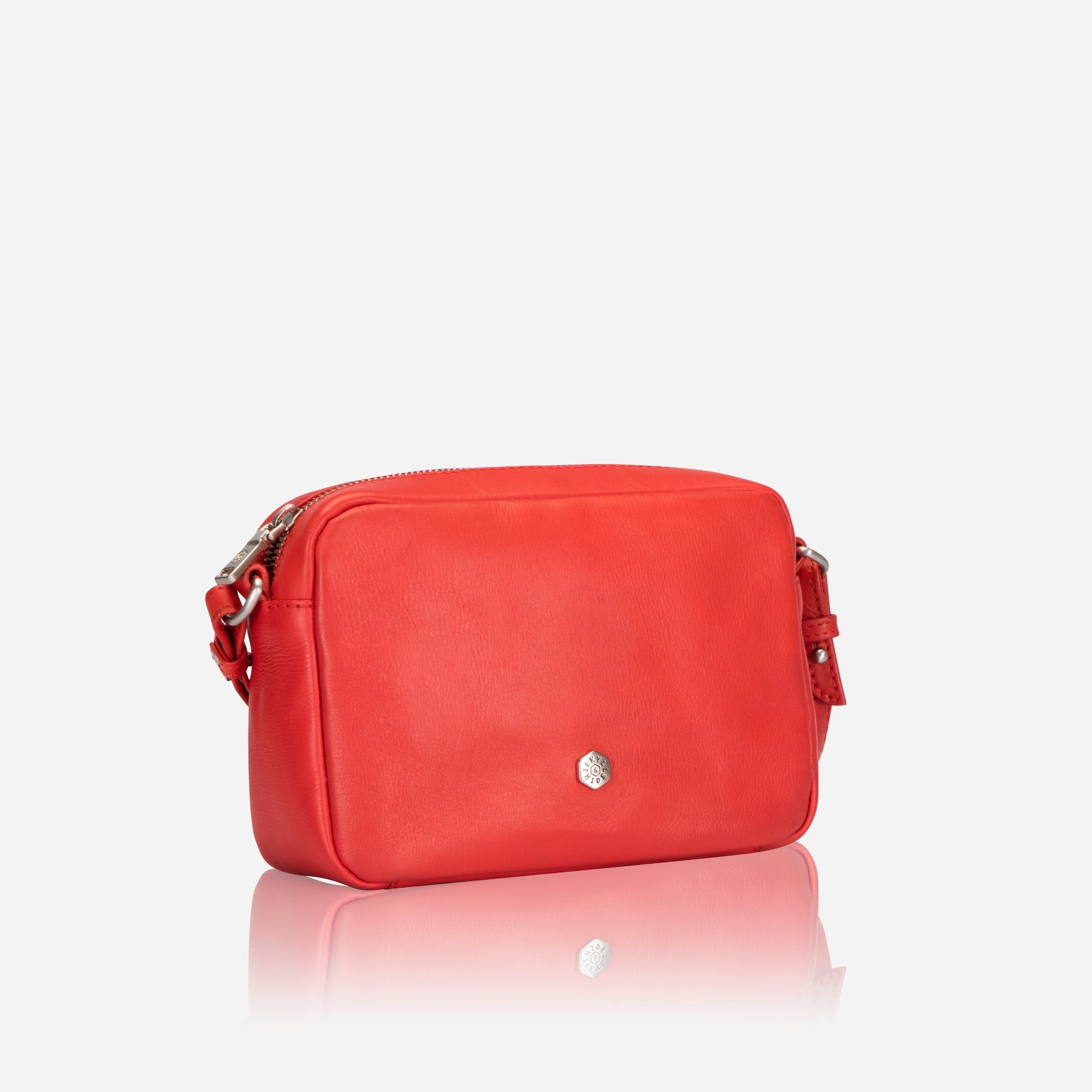 Small Crossbody bag in Candy Apple color with vibrant lining, showcasing its stylish design and compact size.