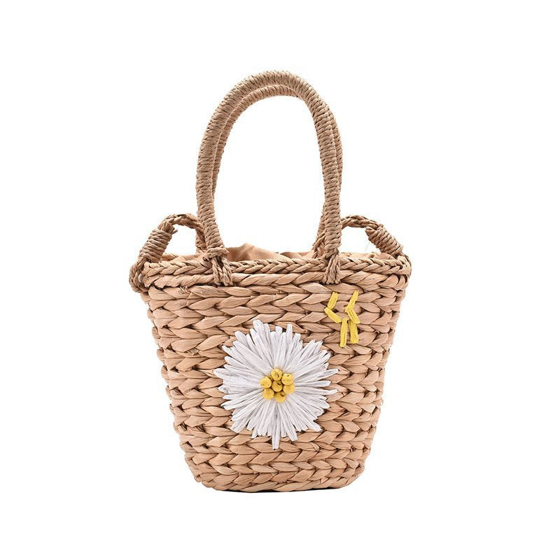 Small straw woven bucket handbag for women in khaki and beige with a soft handle and zipper closure.