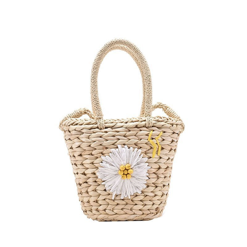 Small straw woven bucket handbag for women in khaki and beige with a soft handle and zipper closure.