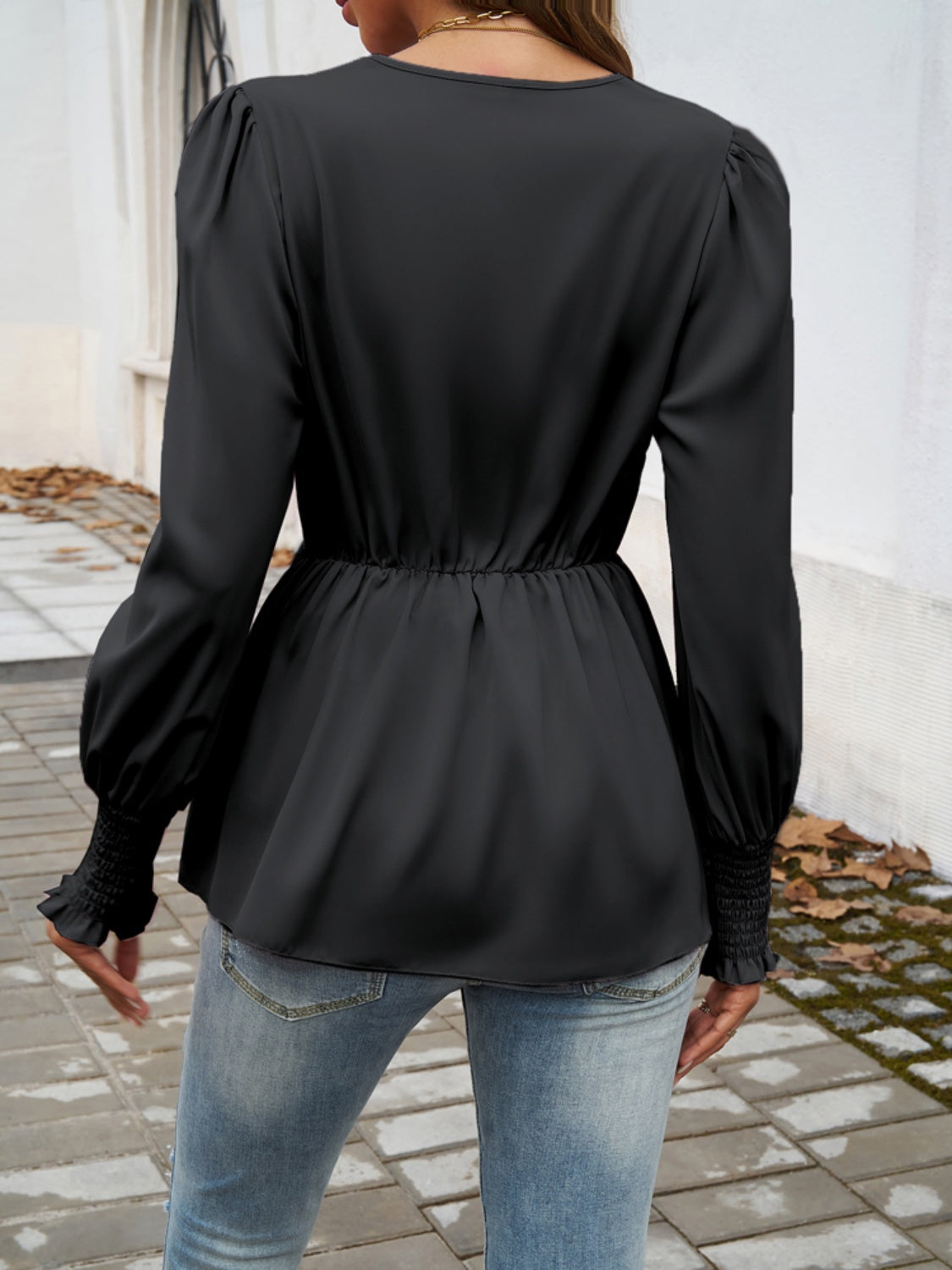 Smocked Surplice Long Sleeve Blouse in elegant design with long sleeves and a flattering neckline.