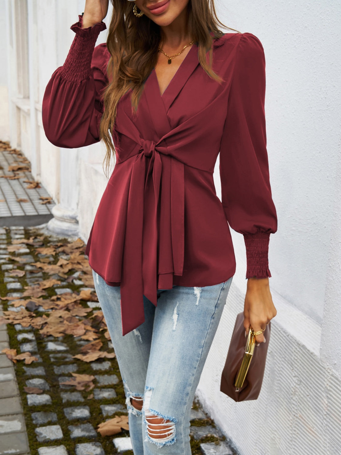 Smocked Surplice Long Sleeve Blouse in elegant design with long sleeves and a flattering neckline.