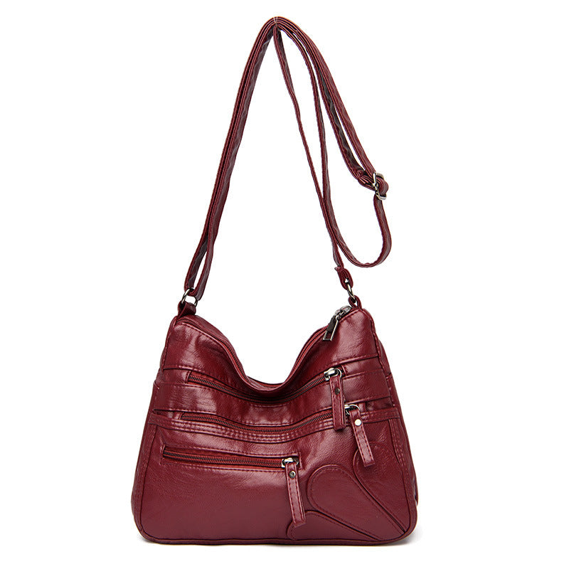 Soft leather large capacity shoulder bag in various colors, designed for middle-aged women, showcasing its stylish and spacious design.