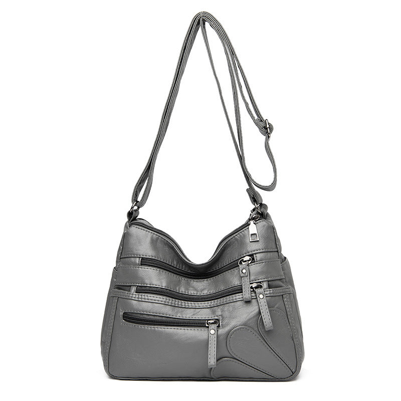 Soft leather large capacity shoulder bag in various colors, designed for middle-aged women, showcasing its stylish and spacious design.