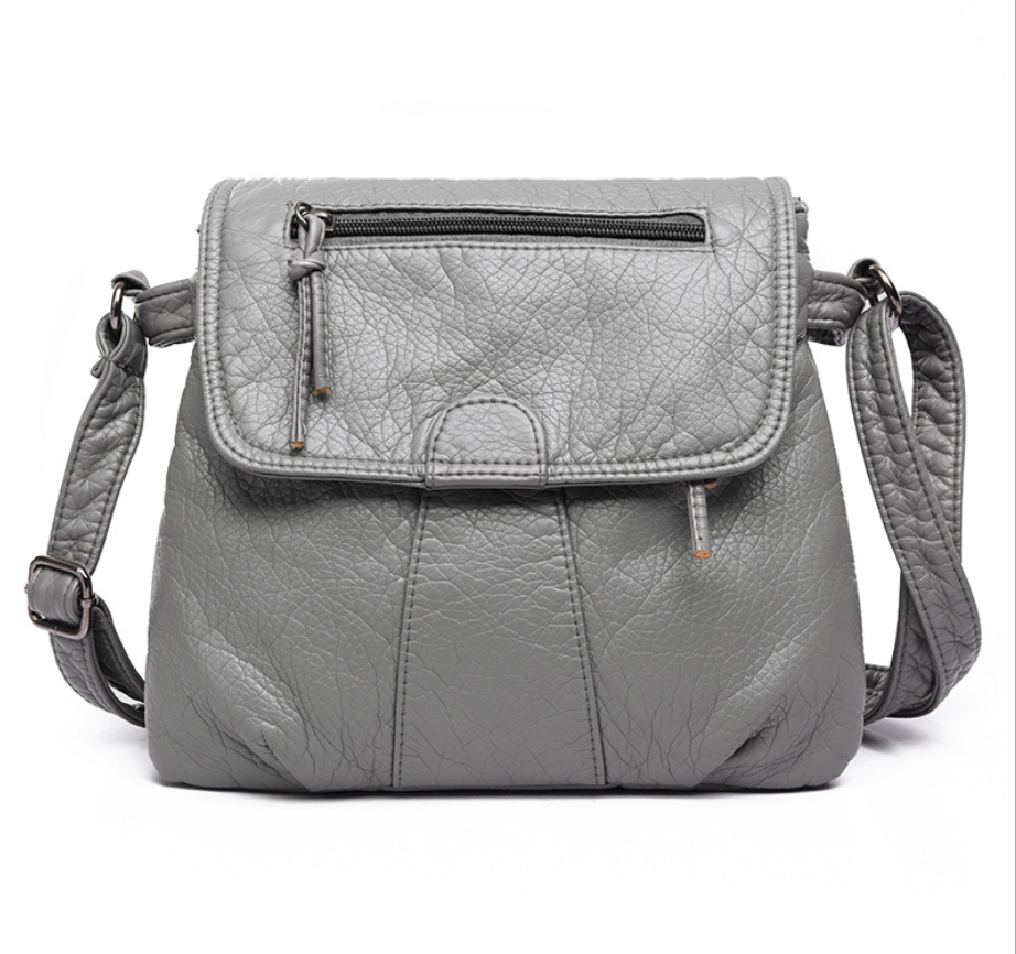 Soft PU Leather Crossbody Messenger Bag for Women in stylish design, showcasing its two-layer structure and adjustable strap.