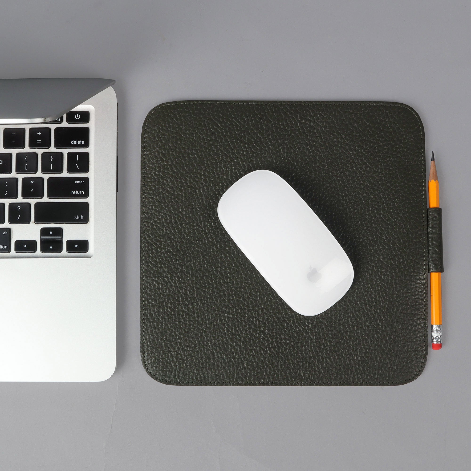 A square mouse pad made of premium full grain leather, featuring a smooth surface and burnished edges, ideal for enhancing workspace aesthetics.