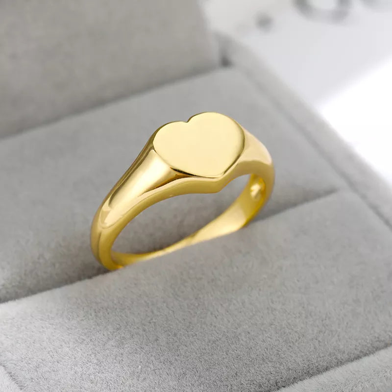 A stylish stainless steel heart ring designed for women, showcasing a trendy heart shape perfect for weddings and special occasions.