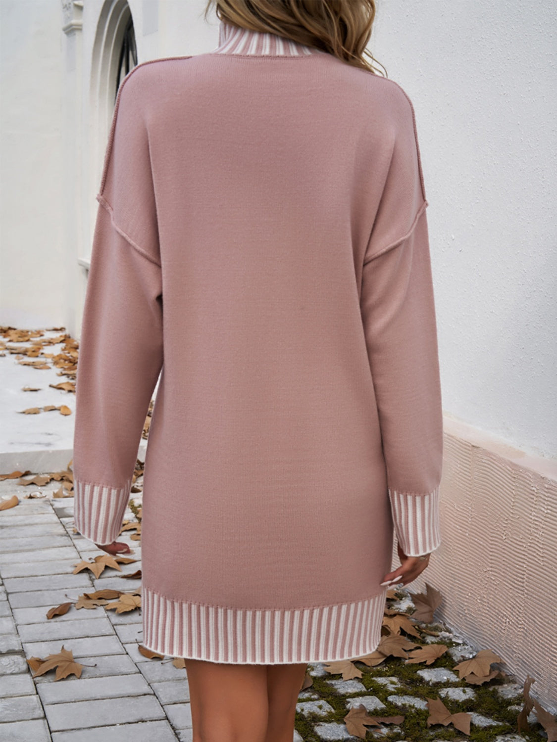 A stylish striped mock neck long sleeve sweater dress, featuring a comfortable fit and elegant design, perfect for various occasions.