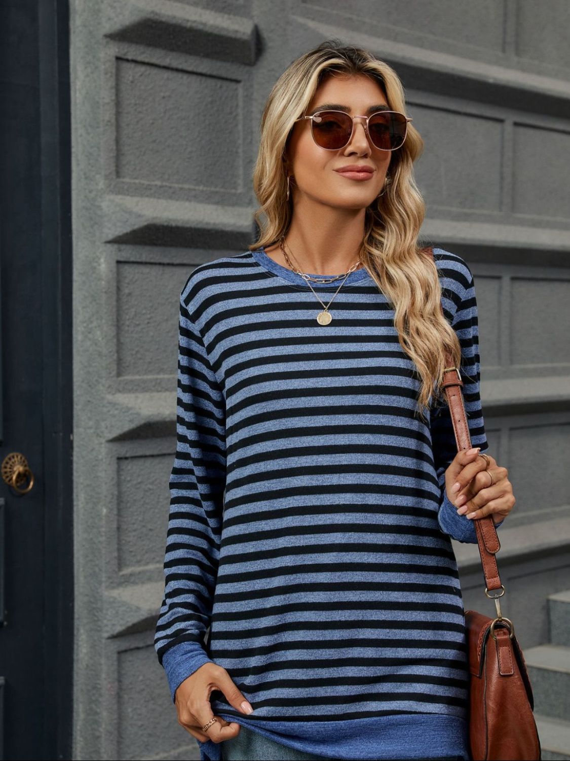 Striped round neck long sleeve t-shirt in various sizes, showcasing its stylish design and comfortable fit.