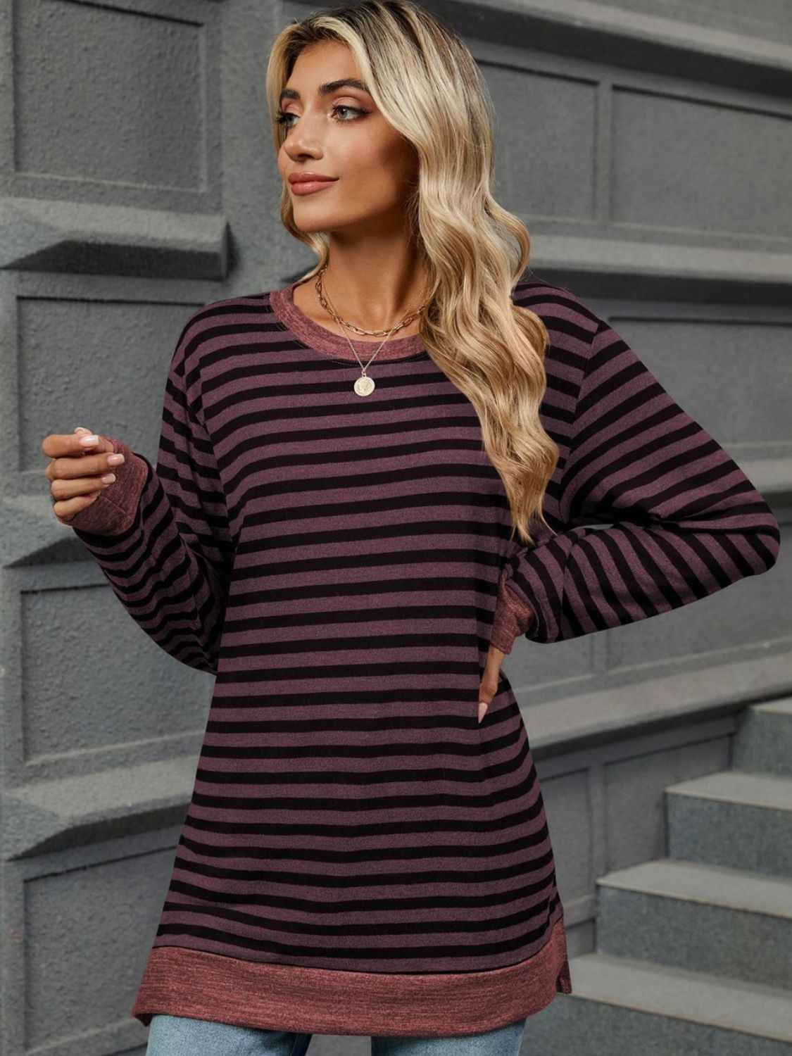 Striped round neck long sleeve t-shirt in various sizes, showcasing its stylish design and comfortable fit.