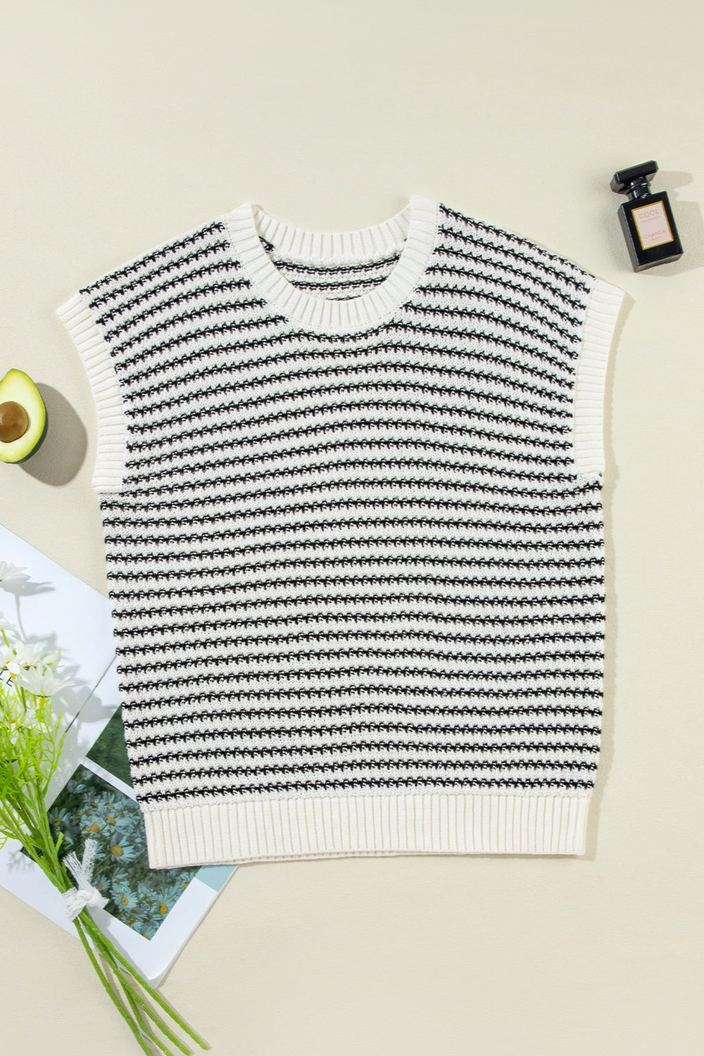 A stylish striped round neck sweater vest in a cozy acrylic-cotton blend, perfect for layering or casual wear.