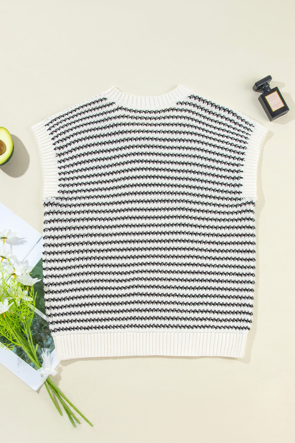 A stylish striped round neck sweater vest in a cozy acrylic-cotton blend, perfect for layering or casual wear.