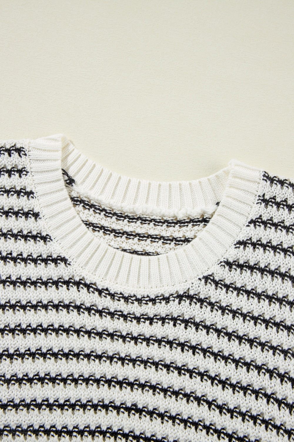 A stylish striped round neck sweater vest in a cozy acrylic-cotton blend, perfect for layering or casual wear.