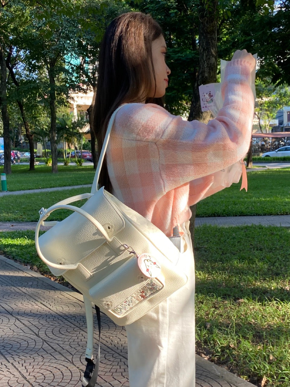 Sunny Day Backpack made from recycled PVC fabric with transparent acrylic flowers and a quilted back for comfort.