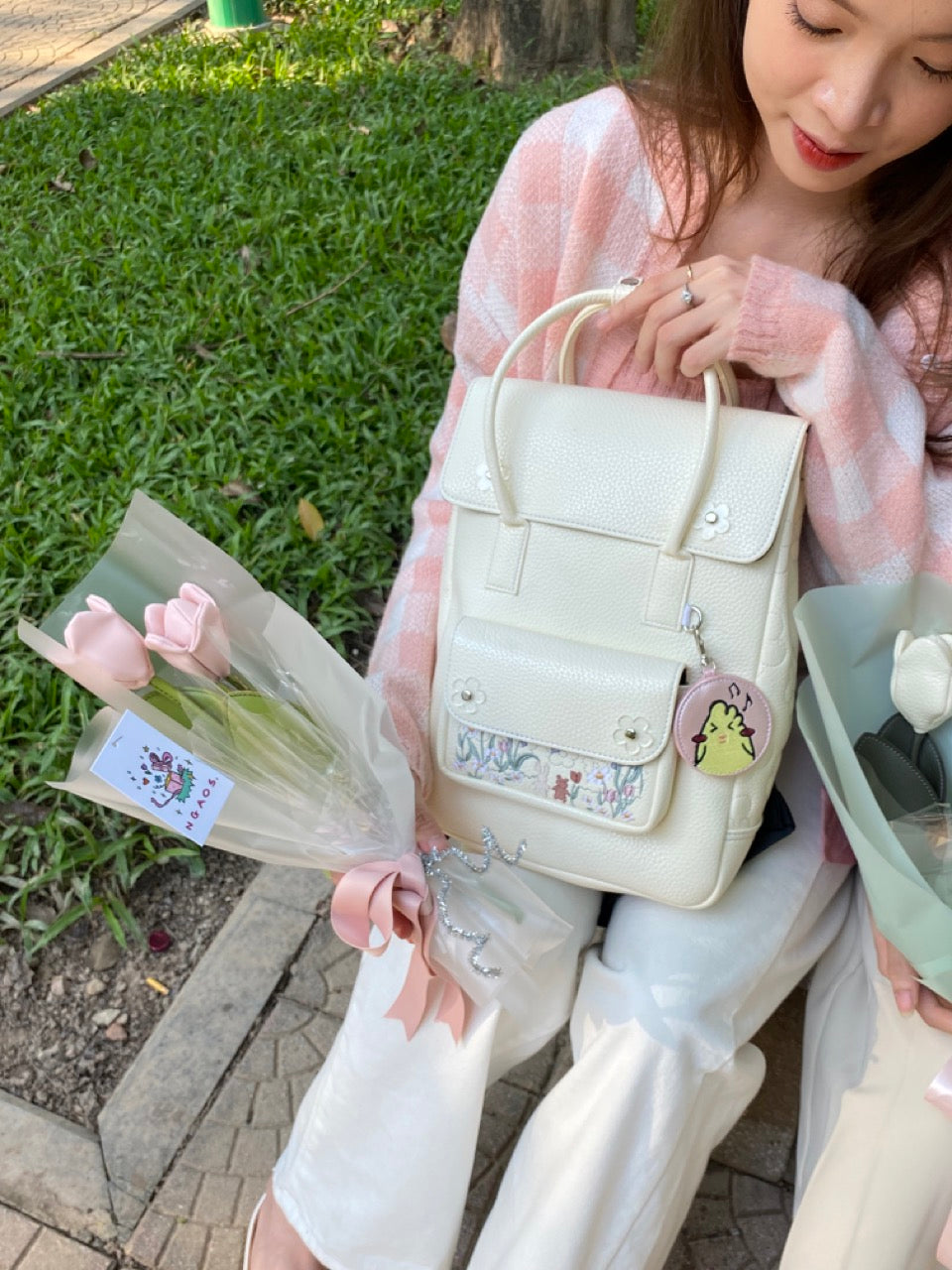 Sunny Day Backpack made from recycled PVC fabric with transparent acrylic flowers and a quilted back for comfort.