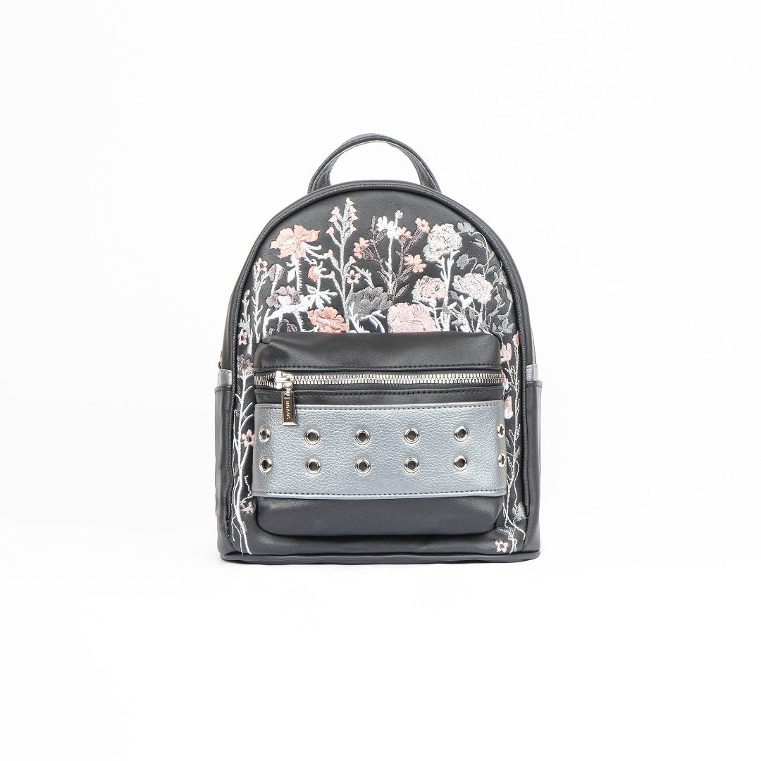 Tabby Medium Backpack in vibrant colors made of vegan leather, showcasing spacious design and adjustable straps.