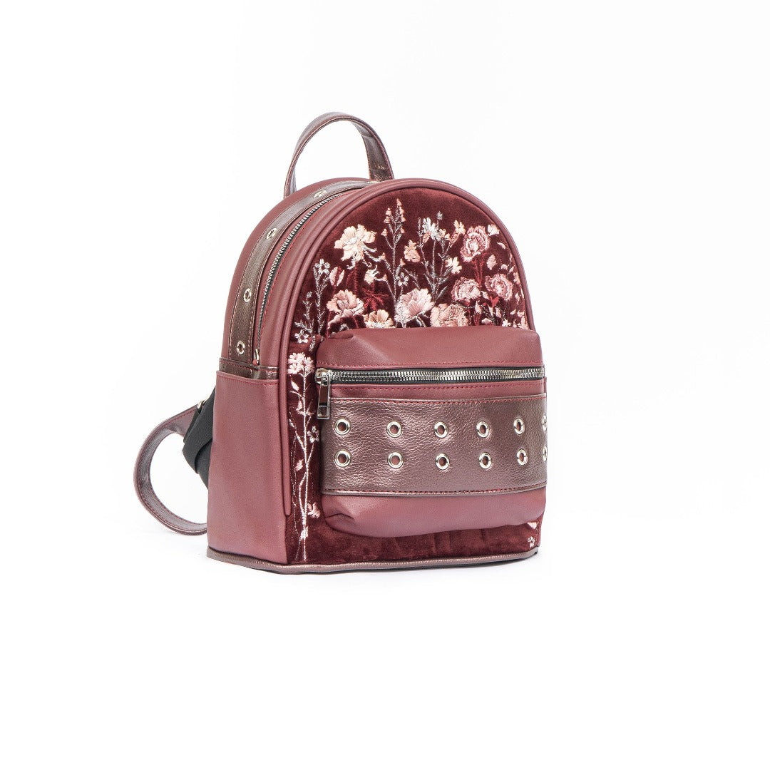 Tabby Medium Backpack in vibrant colors made of vegan leather, showcasing spacious design and adjustable straps.