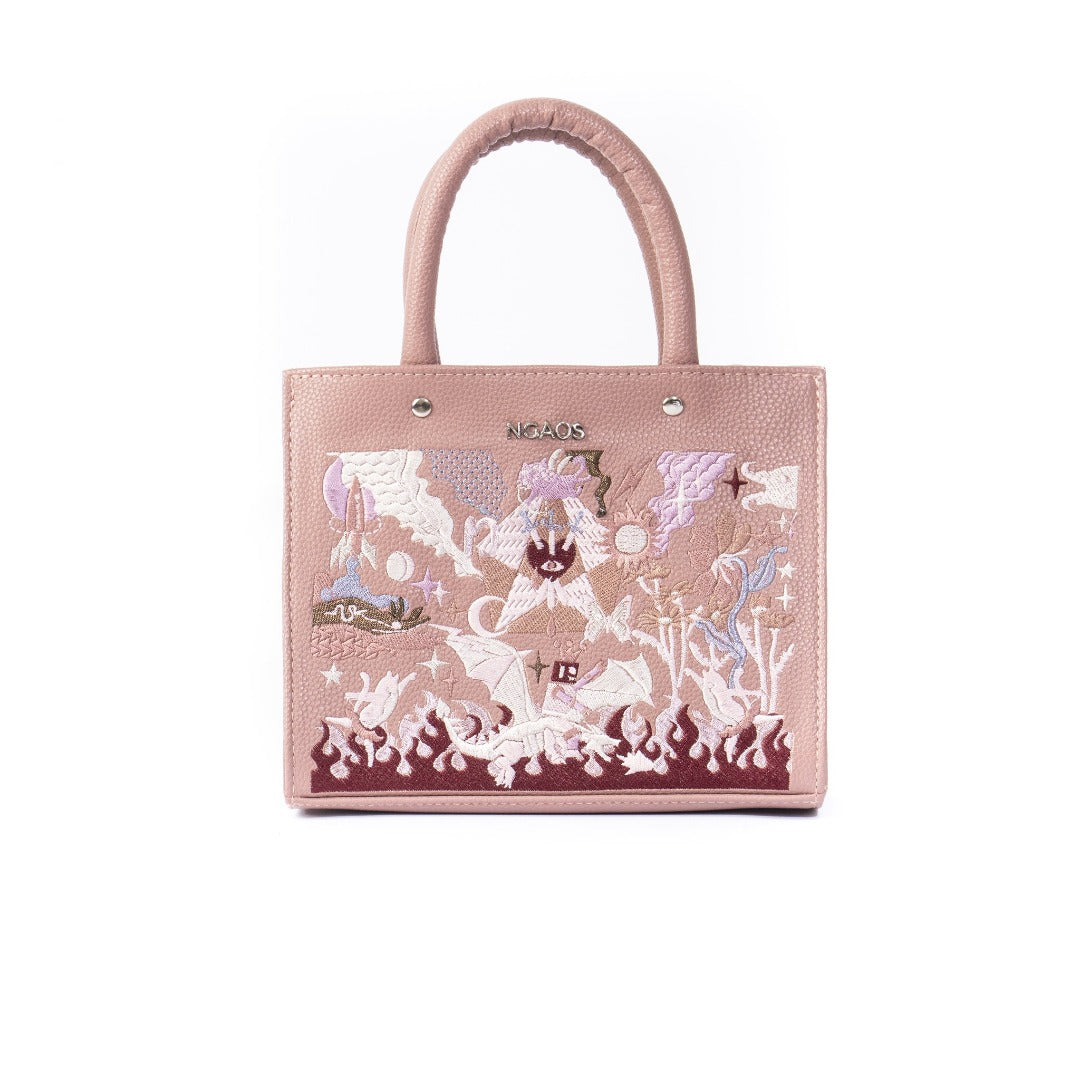 The Book Handbag featuring Jimmi Robot's epic battle design with 3D glittering embroidery on high-quality vegan leather.