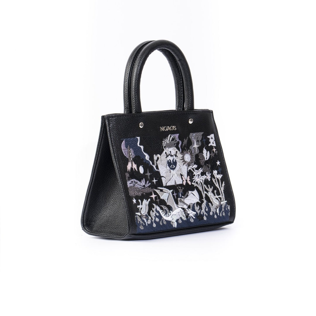 The Book Handbag featuring Jimmi Robot's epic battle design with 3D glittering embroidery on high-quality vegan leather.