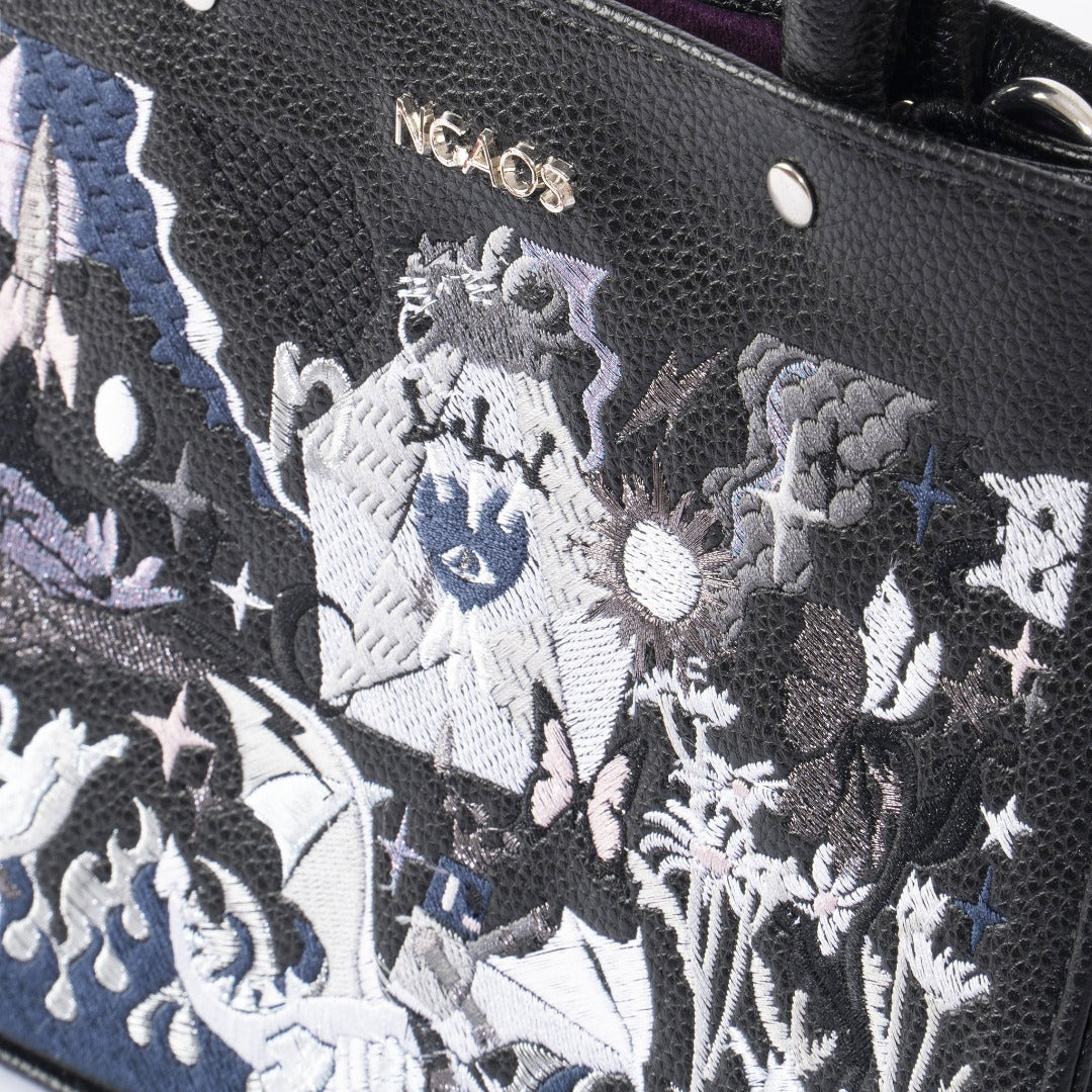 The Book Handbag featuring Jimmi Robot's epic battle design with 3D glittering embroidery on high-quality vegan leather.