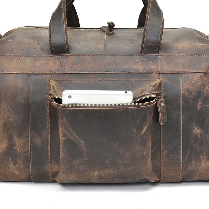 The Colden Duffle Bag made of durable crazy horse leather, featuring a spacious interior and elegant design, perfect for weekend travel.