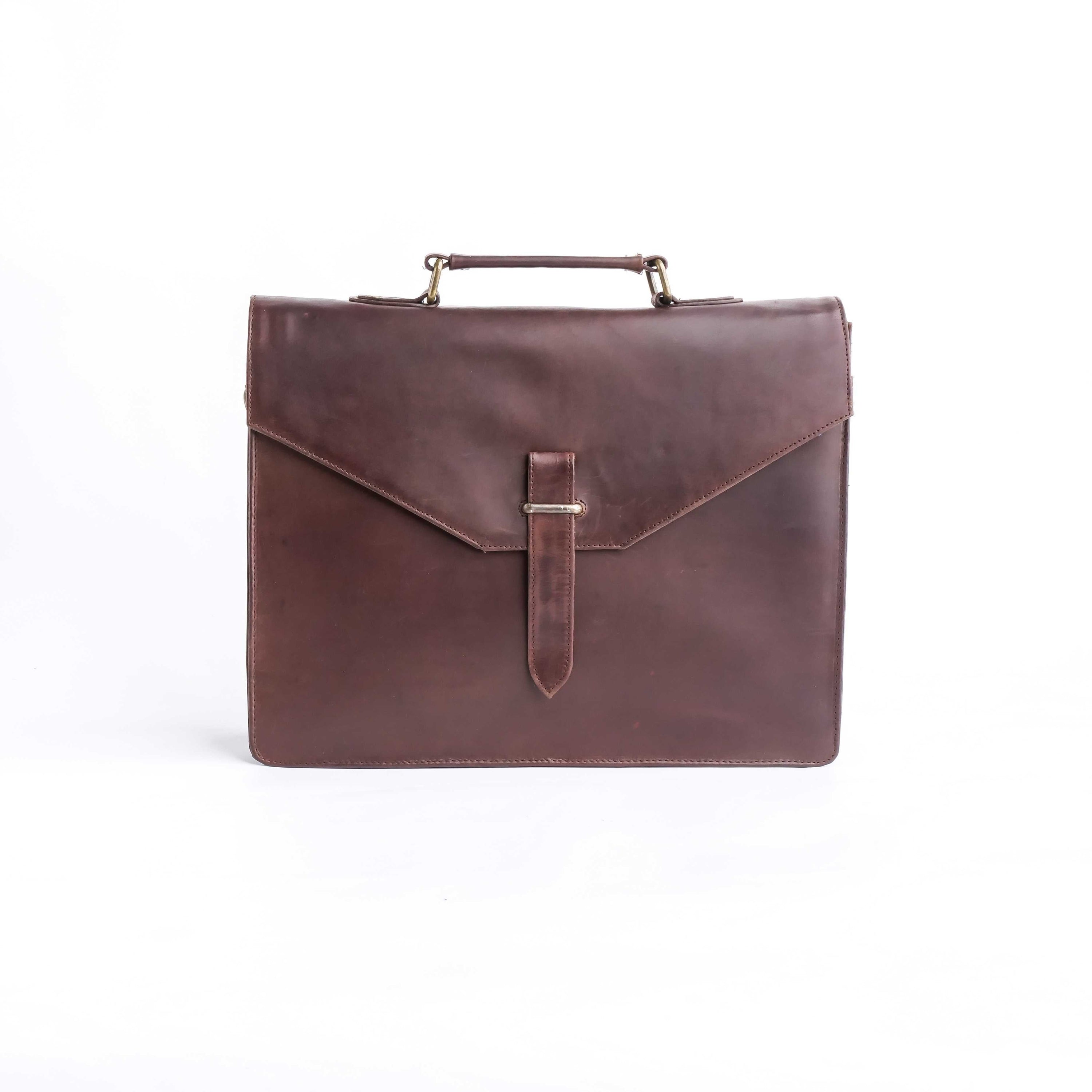 A stylish dark brown corporate pure leather bag with adjustable shoulder strap and top handle, showcasing its spacious compartments and elegant design.