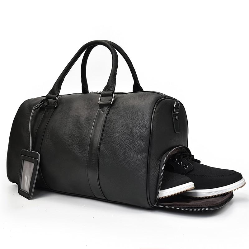 The Endre Weekender vintage leather duffle bag in black, showcasing its smooth texture and stylish design with leather handles and shoulder strap.