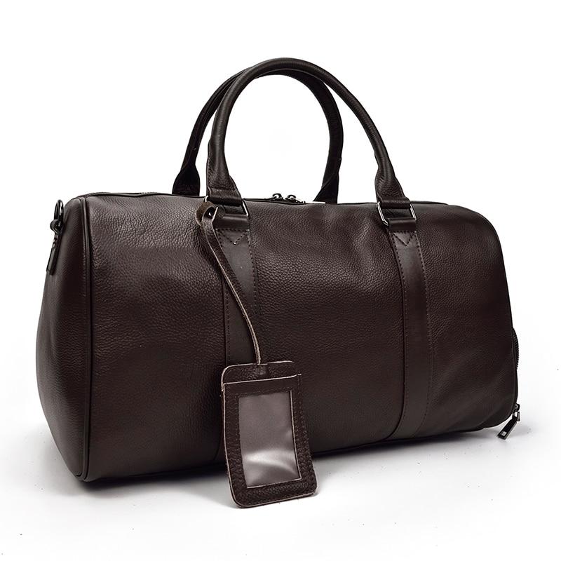 The Endre Weekender vintage leather duffle bag in black, showcasing its smooth texture and stylish design with leather handles and shoulder strap.