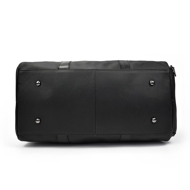 The Endre Weekender vintage leather duffle bag in black, showcasing its smooth texture and stylish design with leather handles and shoulder strap.