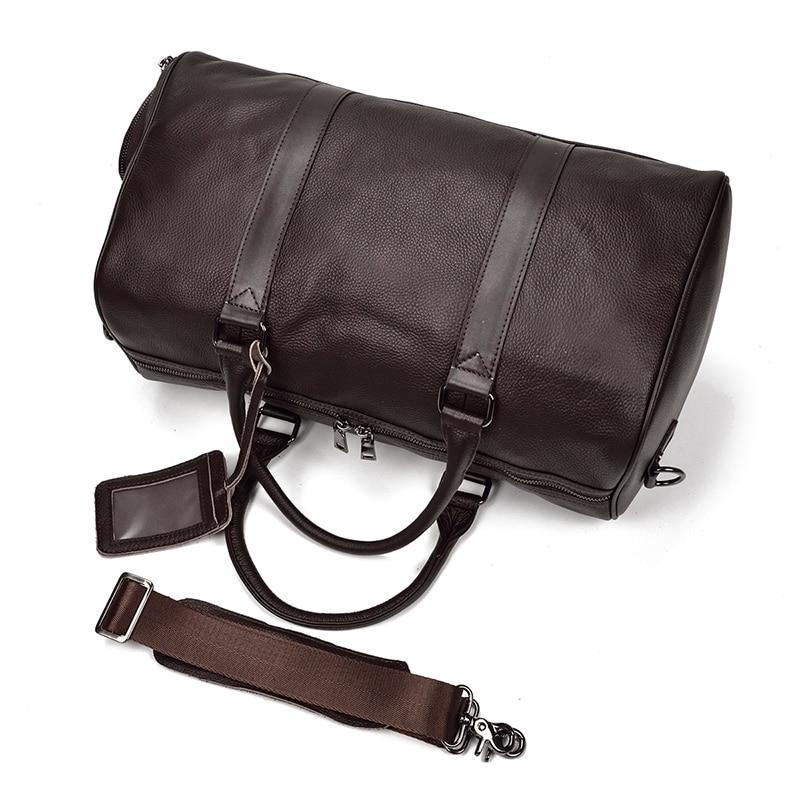 The Endre Weekender vintage leather duffle bag in black, showcasing its smooth texture and stylish design with leather handles and shoulder strap.