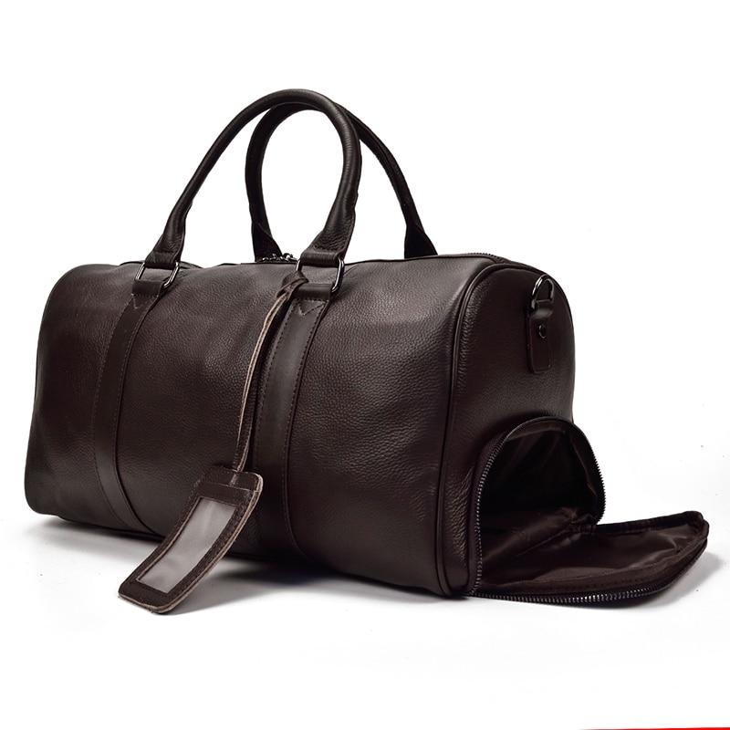 The Endre Weekender vintage leather duffle bag in black, showcasing its smooth texture and stylish design with leather handles and shoulder strap.