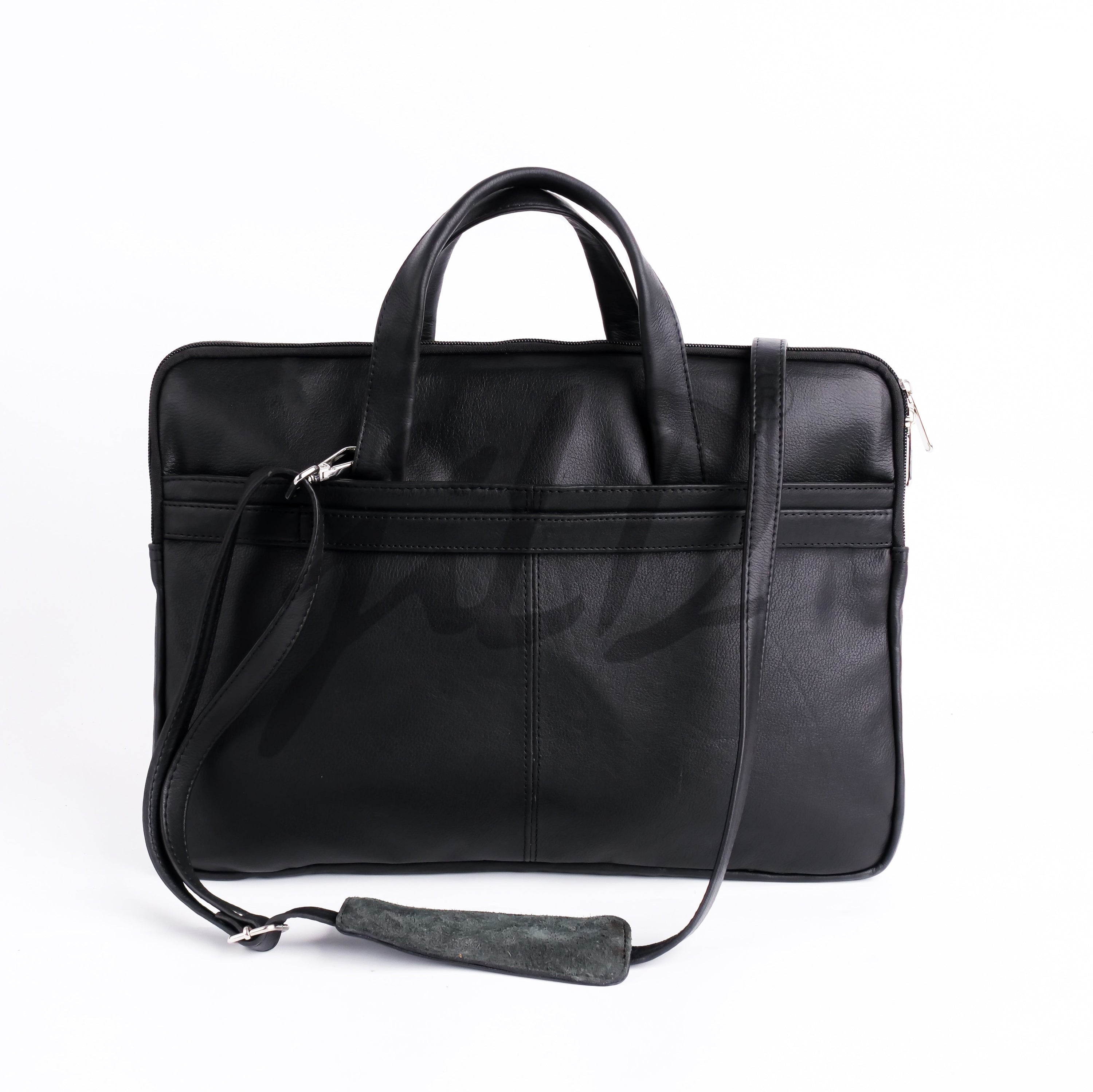 The Founder Ultra Slim Leather Laptop Bag in black, showcasing its sleek design and genuine leather material, perfect for carrying laptops and essentials.