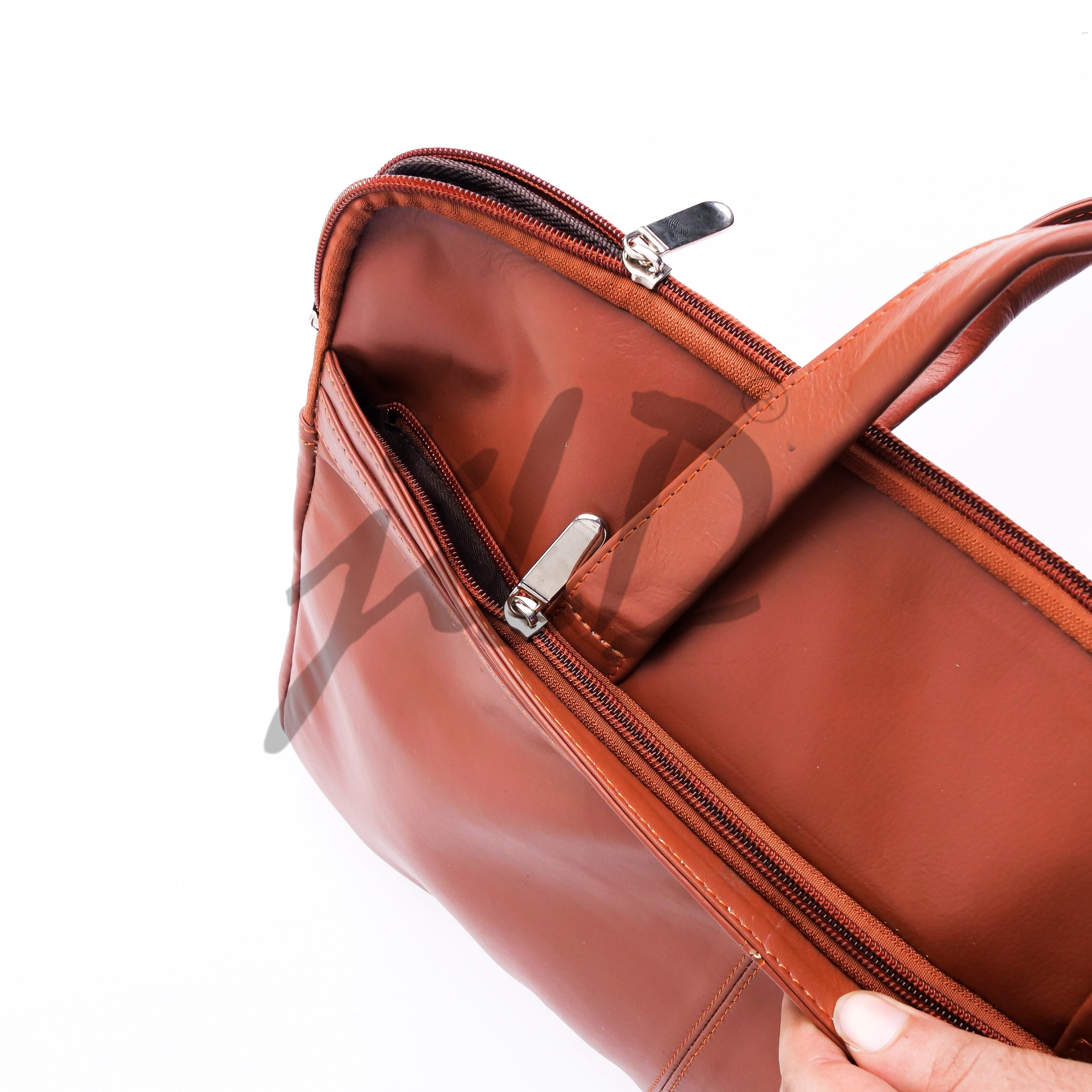 The Founder Ultra Slim Leather Laptop Bag in Tan Brown, showcasing its sleek design and high-quality leather finish.