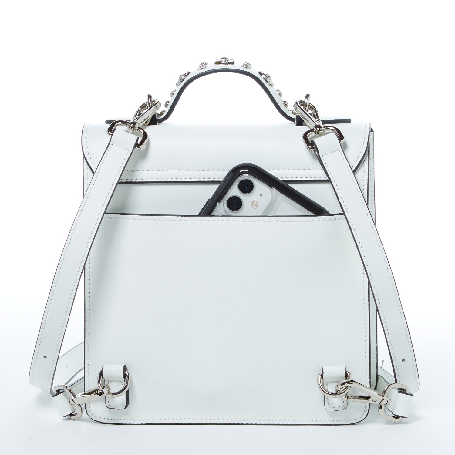 SUSU Hollywood Backpack Leather Purse in white with silver appliqués, showcasing its structured design and adjustable straps.