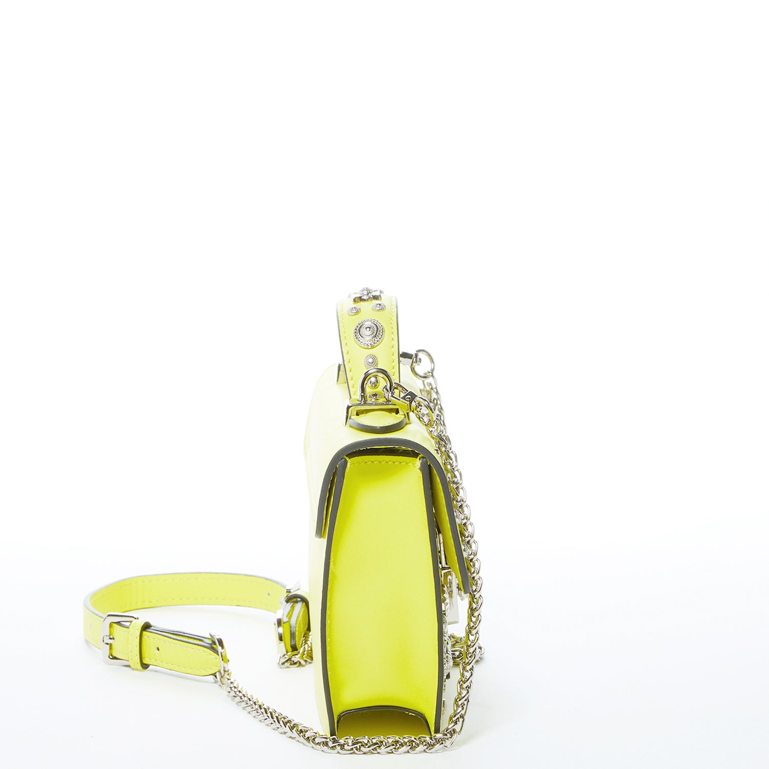 Bright yellow leather crossbody bag with silver studs and chain strap, showcasing a stylish design and functional interior.