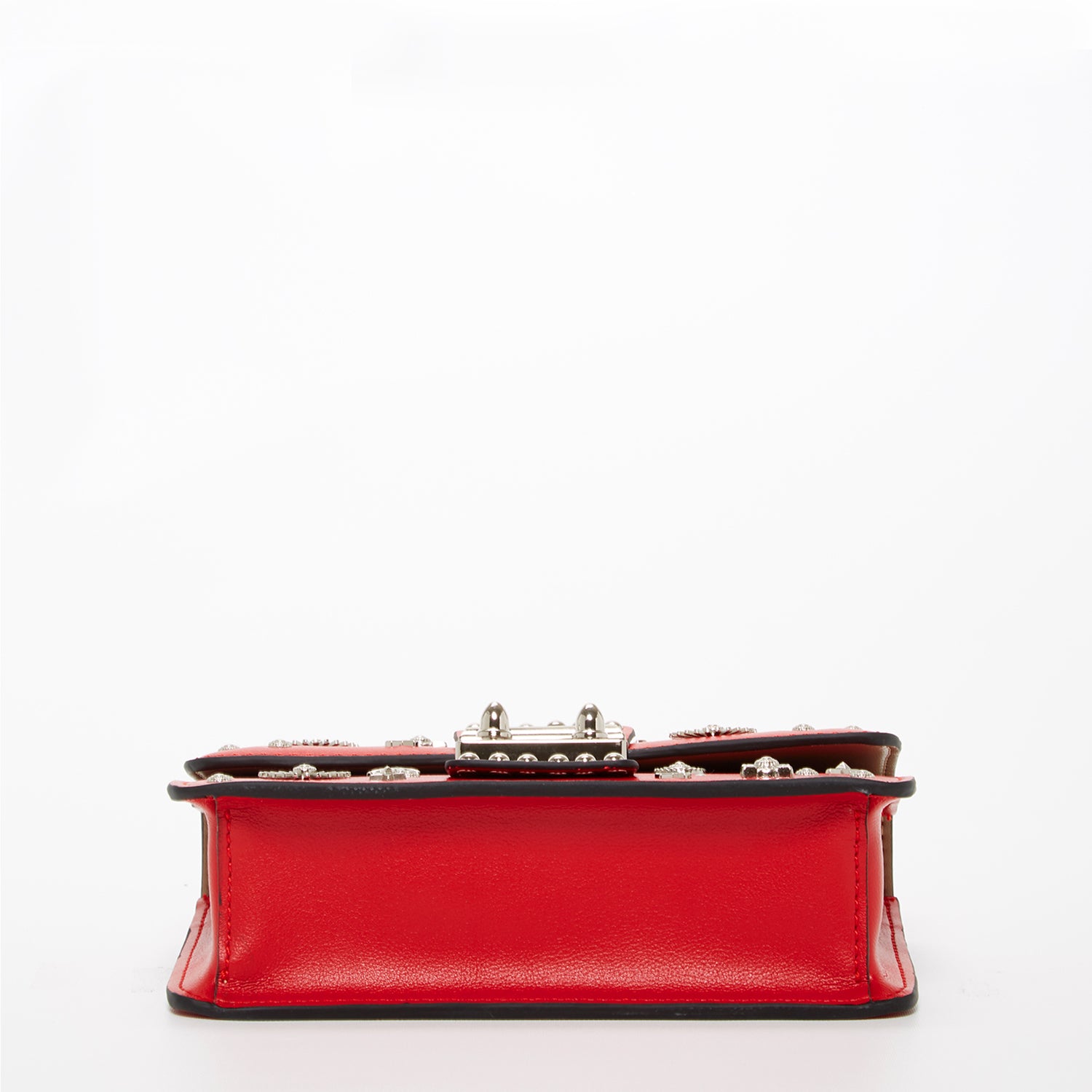 The Hollywood Studded Leather Crossbody Bag in red with silver studs and chain strap, showcasing its stylish design and functionality.