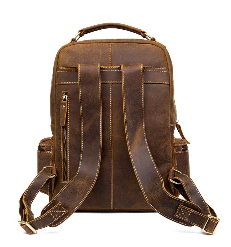 The Langley Backpack made from high-quality crazy horse leather, featuring a rustic deep chocolate brown color and multiple compartments.