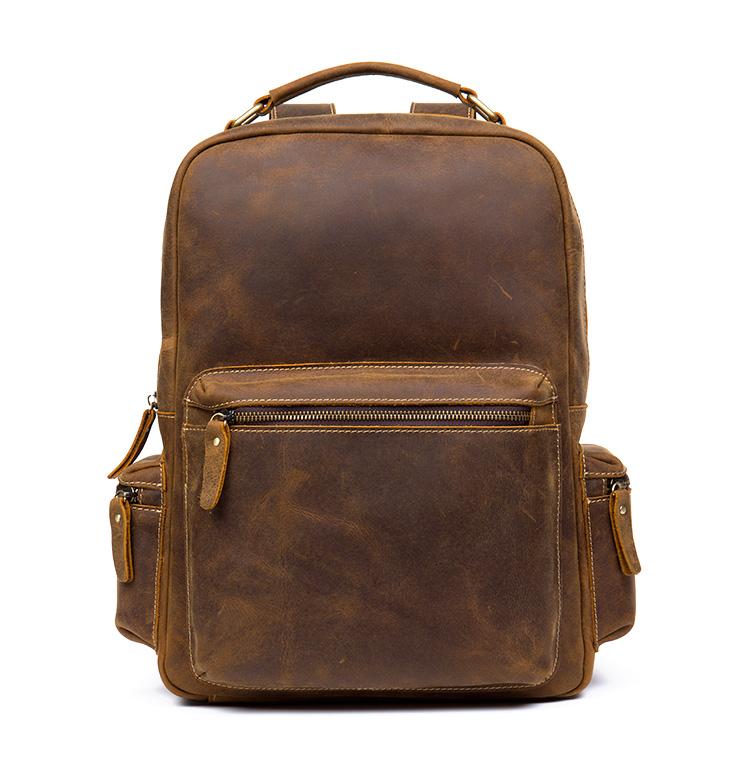 The Langley Backpack made from high-quality crazy horse leather, featuring a rustic deep chocolate brown color and multiple compartments.