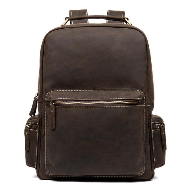 The Langley Backpack made from high-quality crazy horse leather, featuring a rustic deep chocolate brown color and multiple compartments.