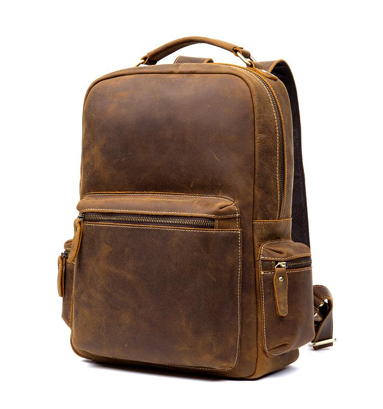 The Langley Backpack made from high-quality crazy horse leather, featuring a rustic deep chocolate brown color and multiple compartments.