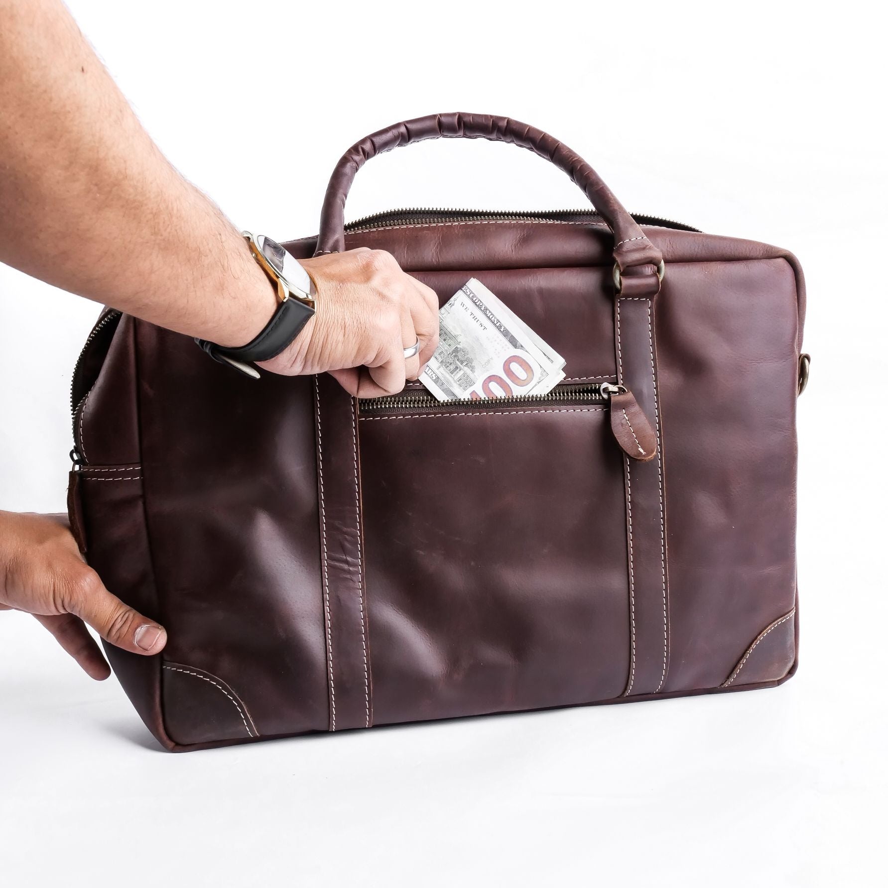 The Maverick Vintage Leather Laptop Bag in Midnight Brown, showcasing its premium leather, adjustable shoulder strap, and spacious design.