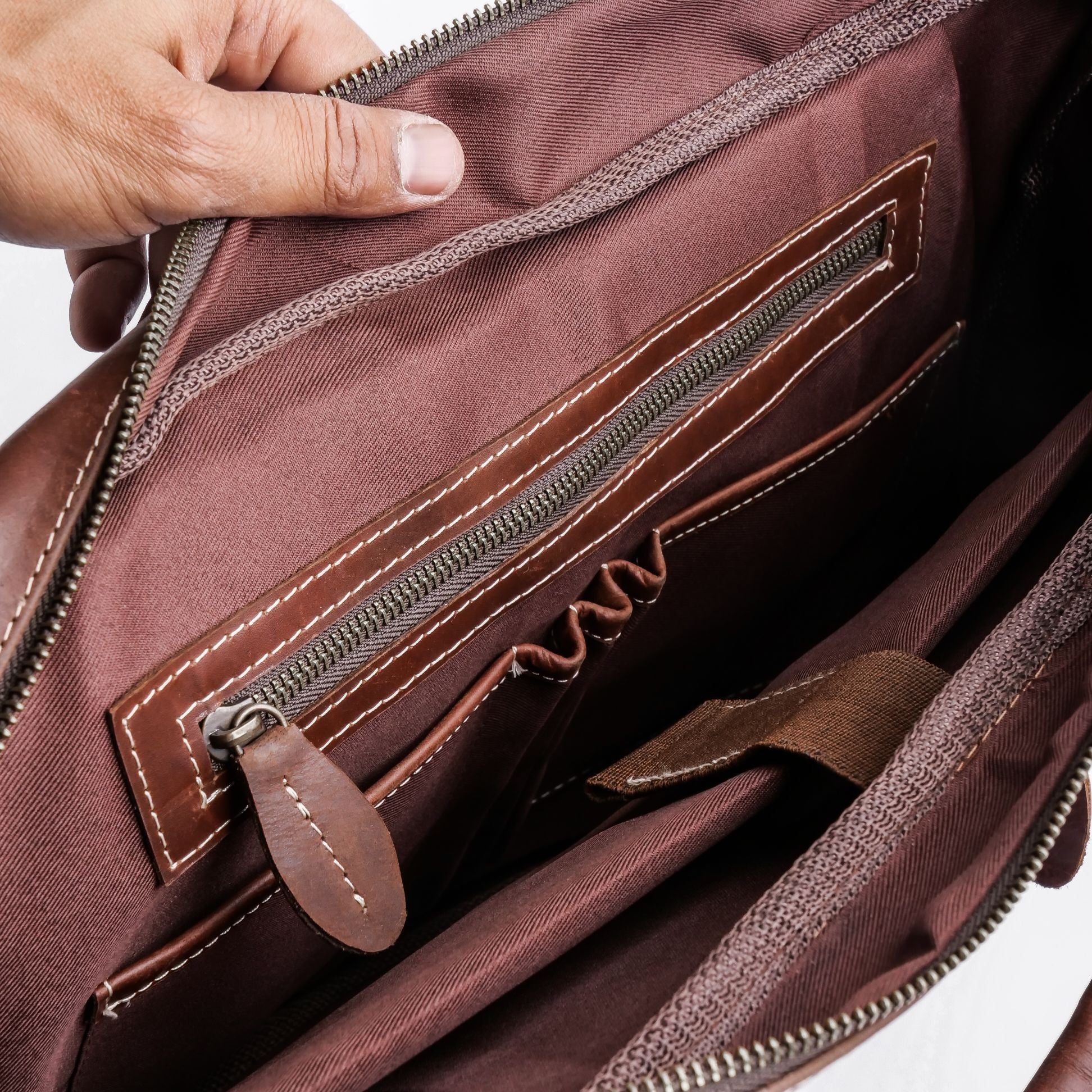 The Maverick Vintage Leather Laptop Bag in Midnight Brown, showcasing its premium leather, adjustable shoulder strap, and spacious design.